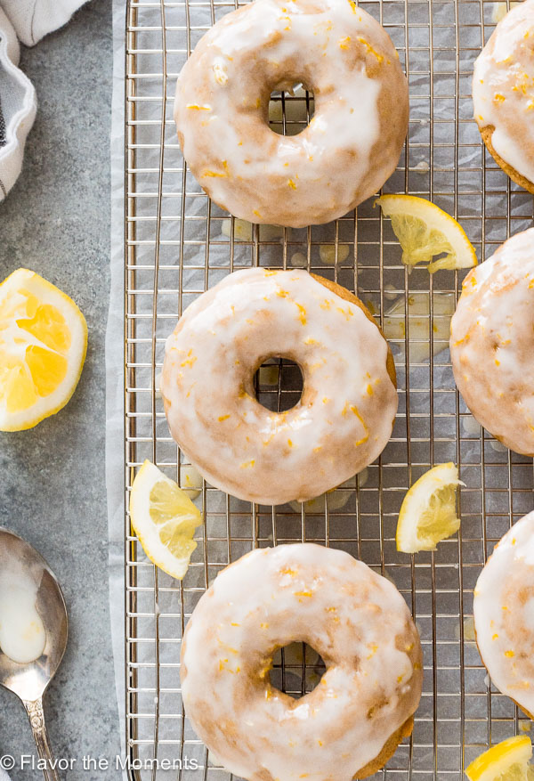 Lemon Glazed Baked Donuts are fluffy whole grain lemon cake donuts topped with a luscious lemon glaze!