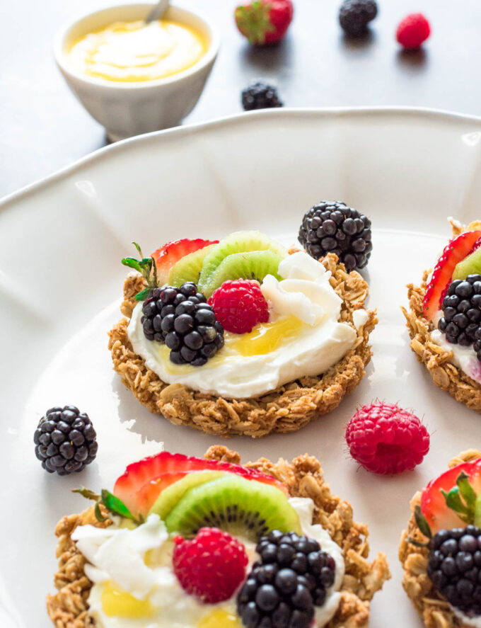 granola crust fruit tart with yogurt and lemon curd close up.