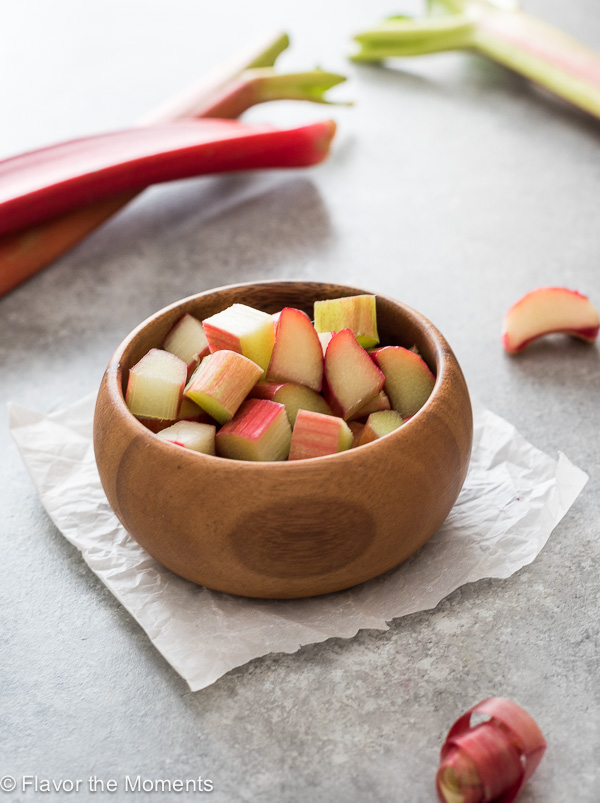 A bowl of chopped rhubarb sitting on a table