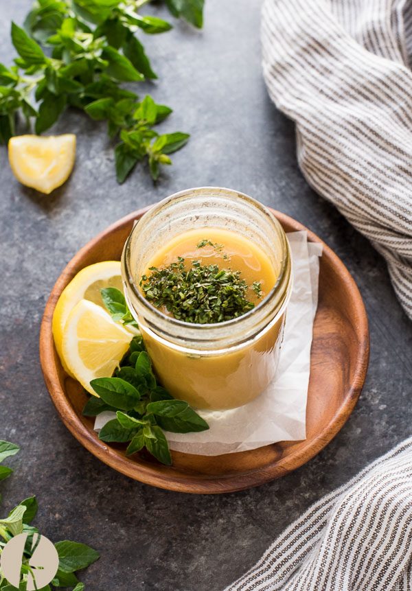 Greek salad dressing topped with chopped oregano