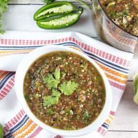 Roasted tomatillo salsa verde in a white bowl