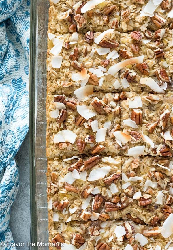 Hummingbird cake baked oatmeal cut into squares in baking dish