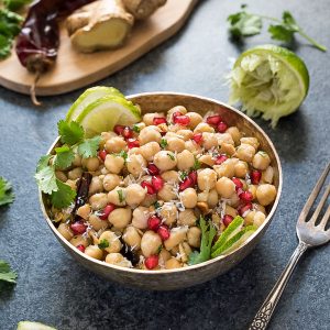 Chickpea salad in bowl with pomegranate lime and cilantro
