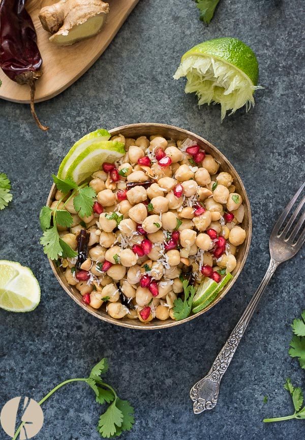 Chickpea salad in bowl with pomegranate lime and cilantro