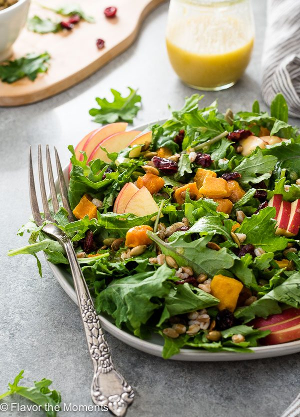 Harvest salad on plate with butternut squash and apple with fork