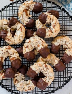 Chocolate dipped almond horn cookies on wire rack