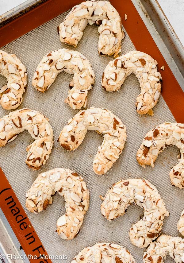 Almond horn cookies on baking sheet