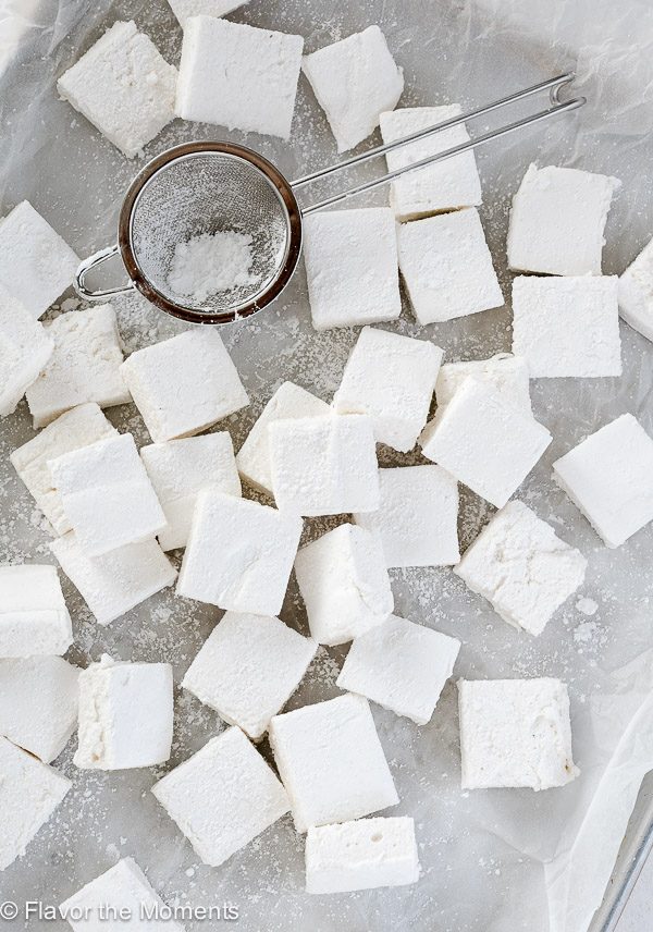 Homemade marshmallows scattered on waxed paper
