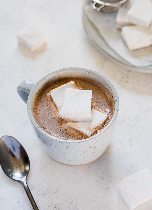 Dairy free hot chocolate in a mug with marshmallows on top
