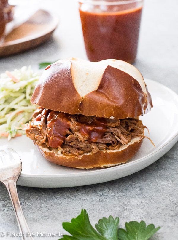 Instant pot pulled pork sandwich with bbq sauce and coleslaw