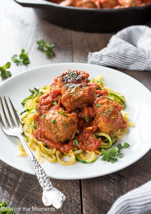 Paleo turkey meatballs on white plate with zoodles