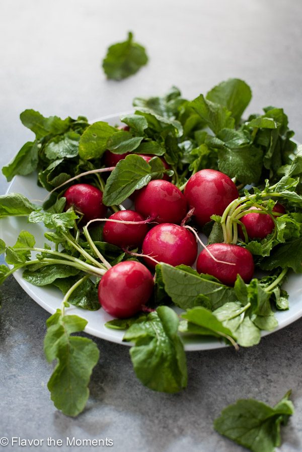 Radishes on a white plate