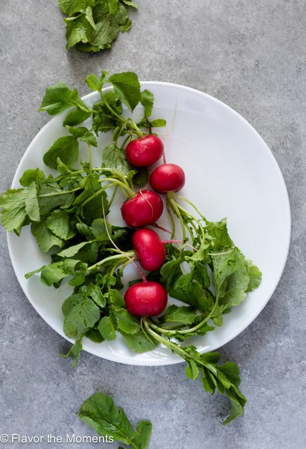 Radishes on a white plate