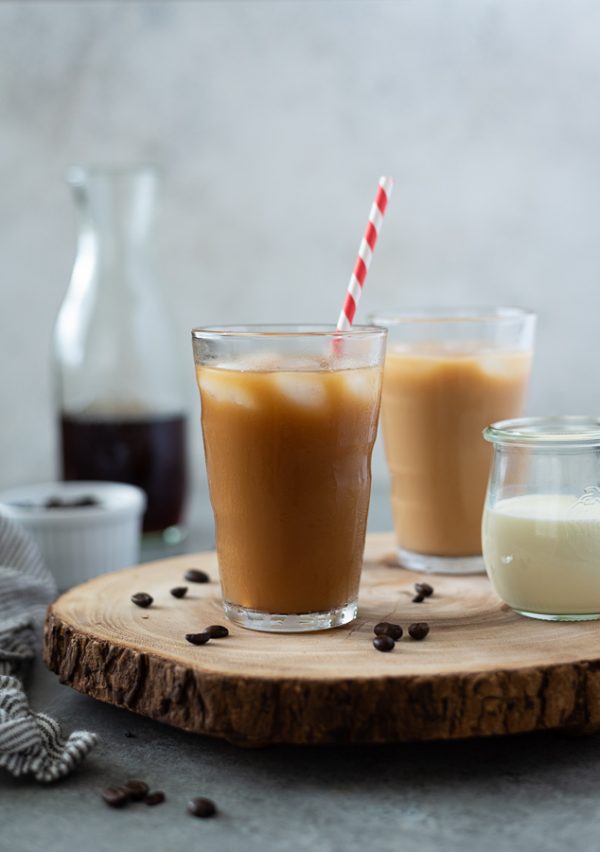front view of cold brew coffee recipe in glass with ice and straw