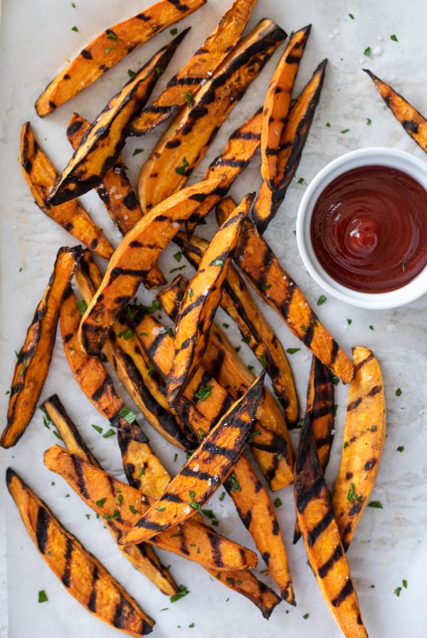 overhead shot of grilled sweet potato fries with ketchup