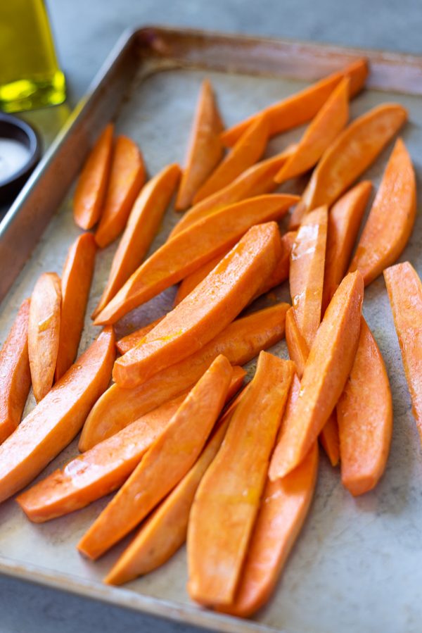 sweet potato wedges tossed in olive oil before grilling