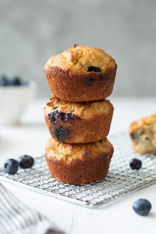 stack of almond flour blueberry muffins on a wire rack