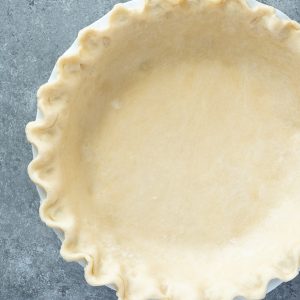 Close up of flaky pie crust in pie plate