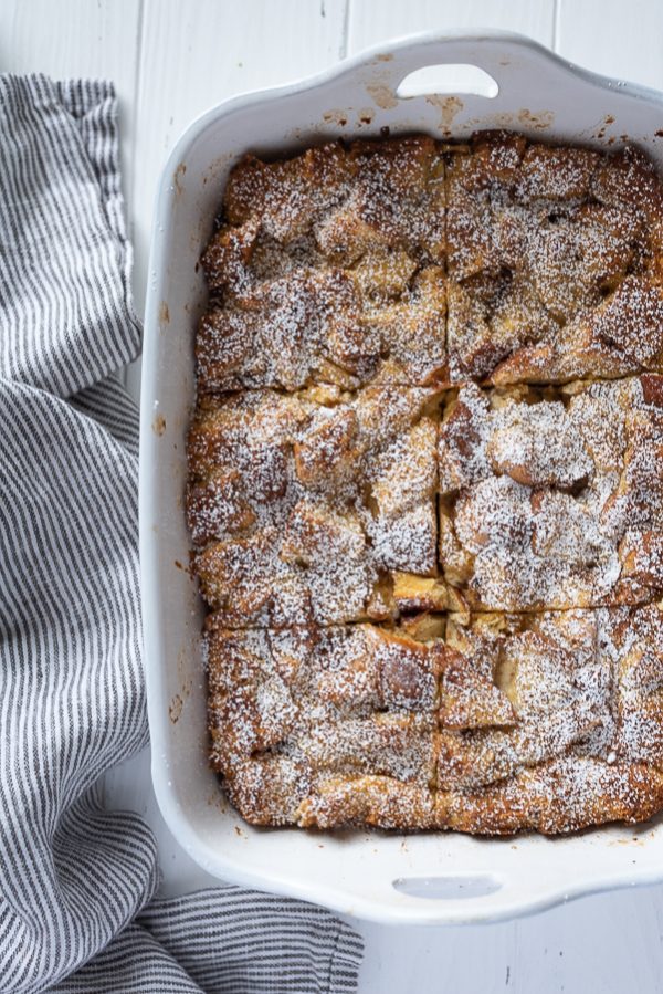 overhead shot of eggnog french toast casserole cut into squares