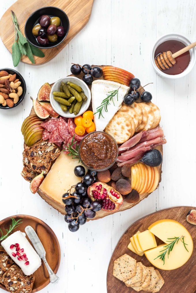 Fall cheese board filled with a variety of cheeses, meats, etc.