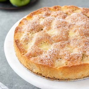 french apple cake dusted with powdered sugar