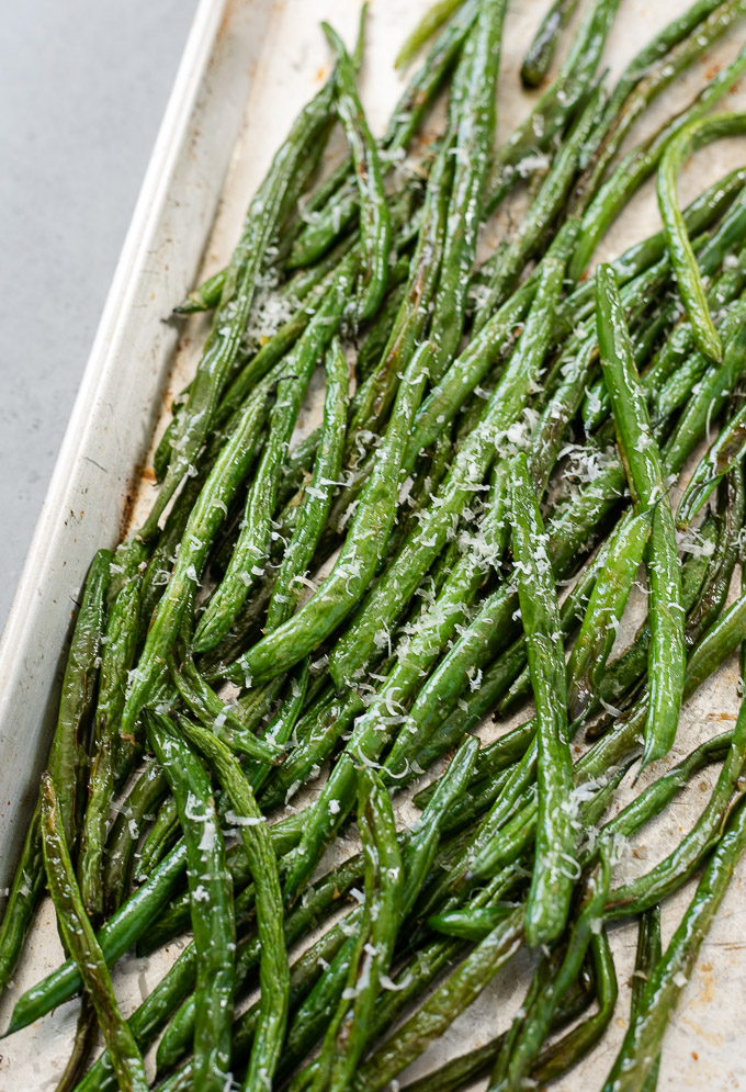 Roasted green beans on a baking sheet