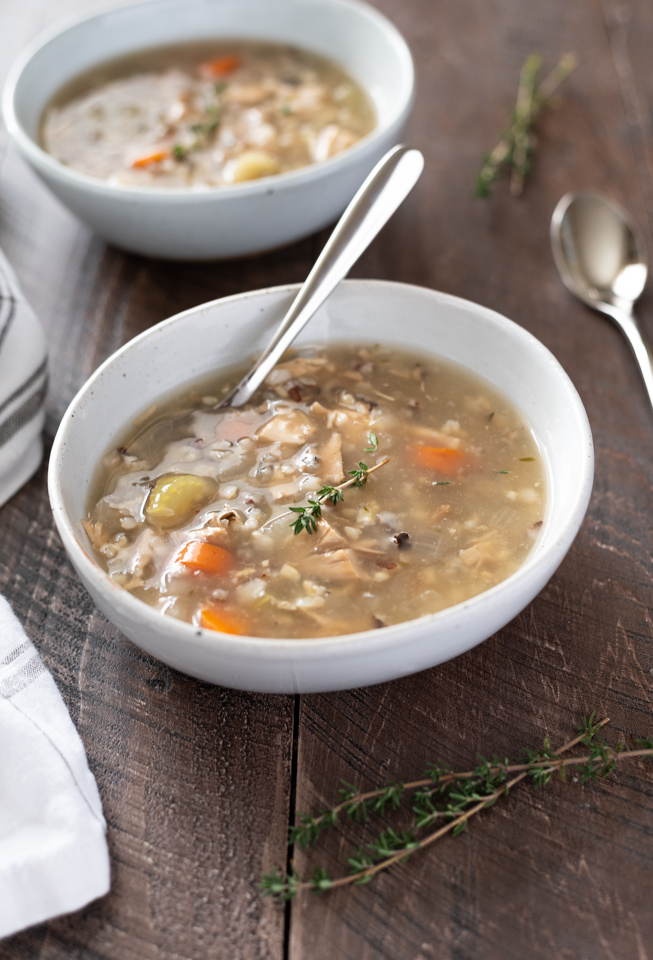 Crockpot turkey wild rice soup in a bowl with spoon