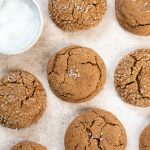 Soft gingersnap cookies laying flat with sparkle sugar
