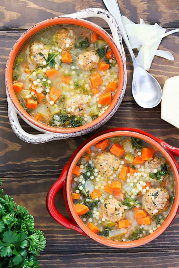 Bowls of Italian wedding soup with parsley