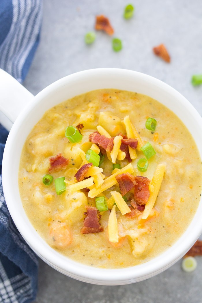 Creamy potato soup in a bowl with bacon and cheese