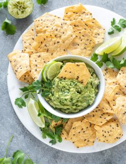 Homemade guacamole with a chip dipped into the center