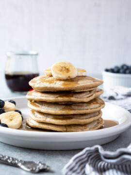 Stack of oat flour pancakes on a plate