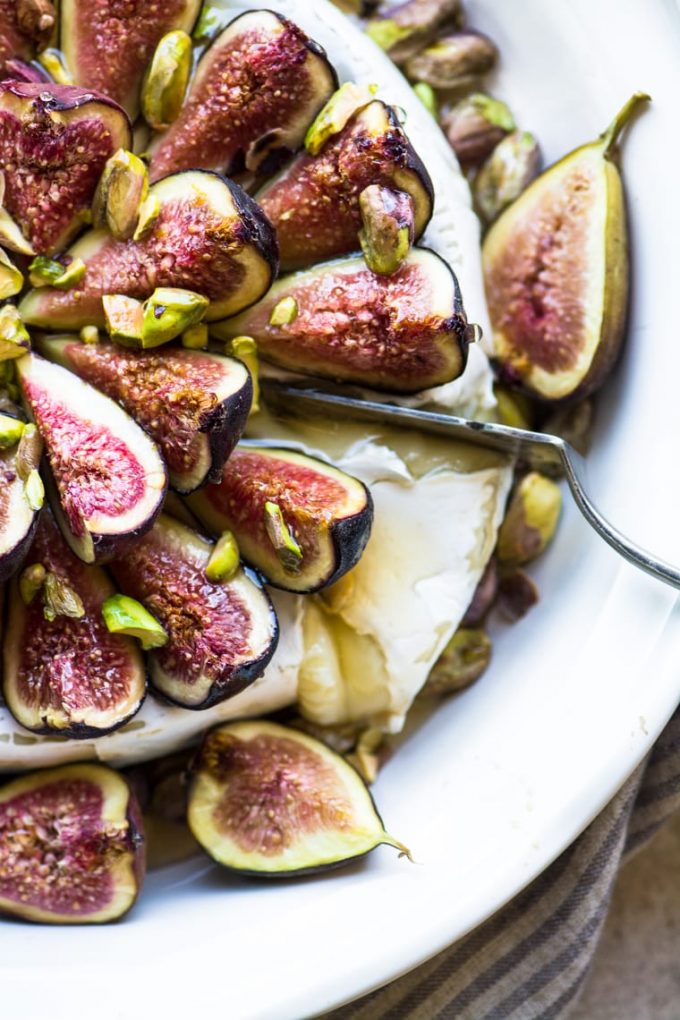 Brie cheese topped with honey and figs.