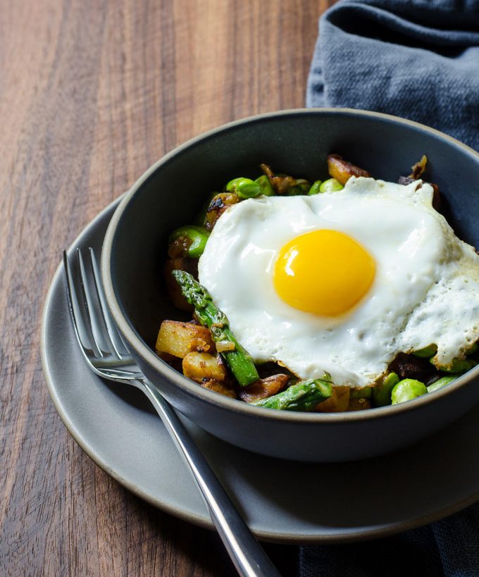Breakfast hash in a bowl with an egg on top