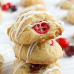 Three cranberry white chocolate cookies stacked on each other.