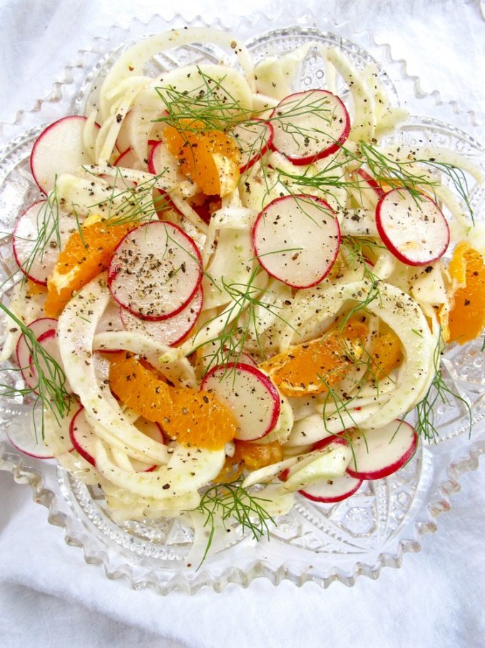 Fennel radish citrus salad on a glass plate