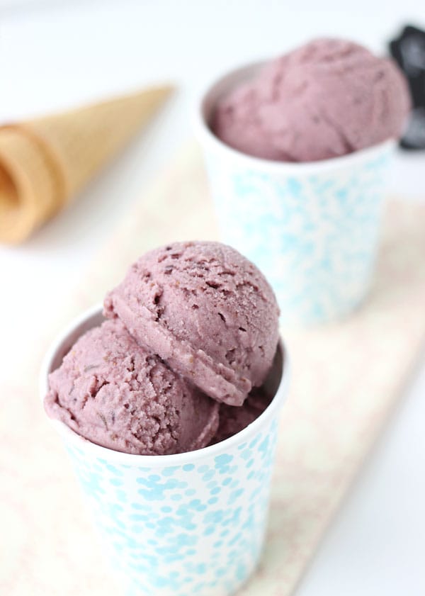 Two blue floral cups filled with scoops of fig ice cream.
