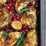 Garlic rosemary cranberry chicken in a baking dish.