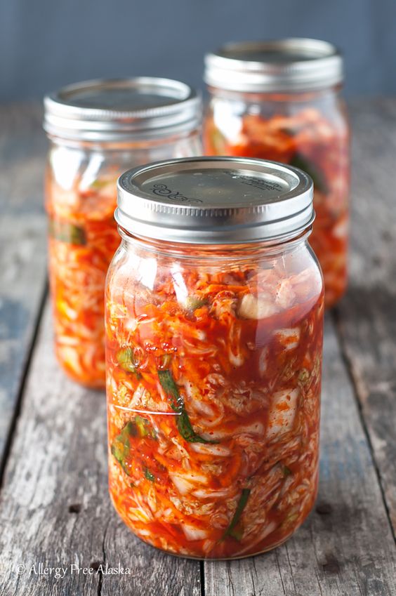 Three jars of homemade kimchi.