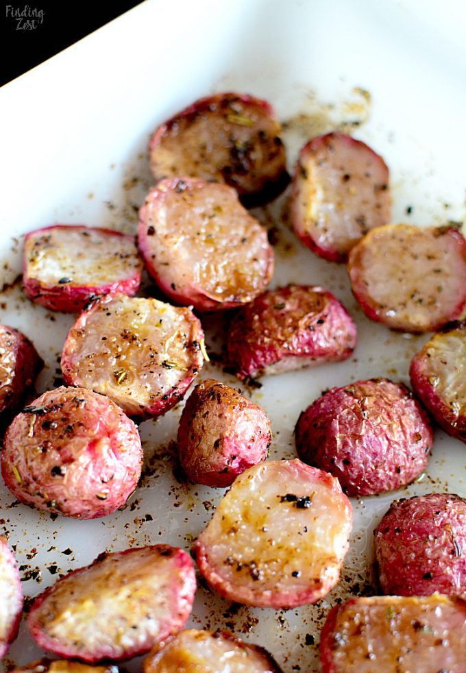 Roasted radishes on a white plate