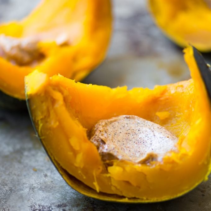 Roasted slices of kabocha squash topped with flavored butter.
