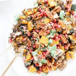 Overhead view of a platter of wild rice salad with kabocha squash.