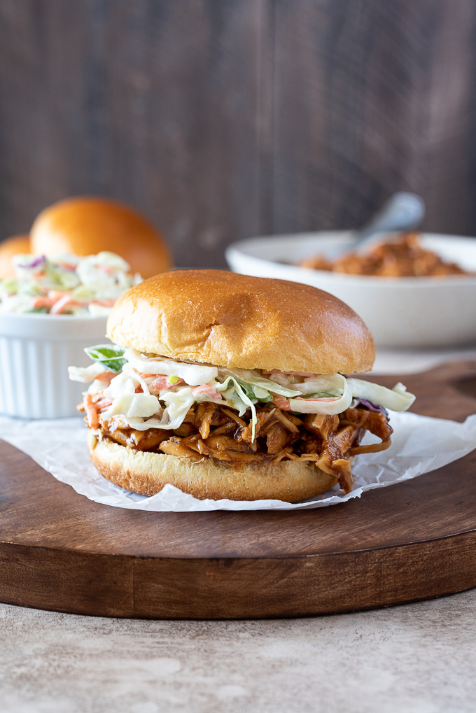BBQ pulled chicken sandwich topped with coleslaw
