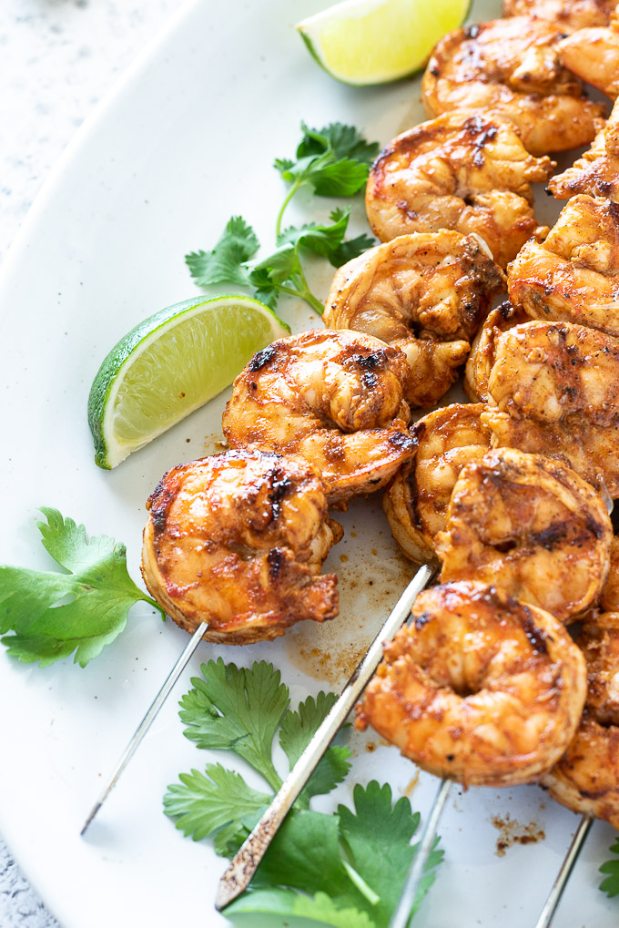 Grilled shrimp on skewers with lime and cilantro