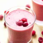 A glass of cranberry raspberry smoothie.