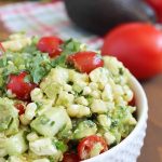 Bowl of grilled corn and avocado salad