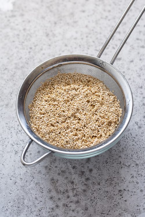 quinoa in fine mesh strainer