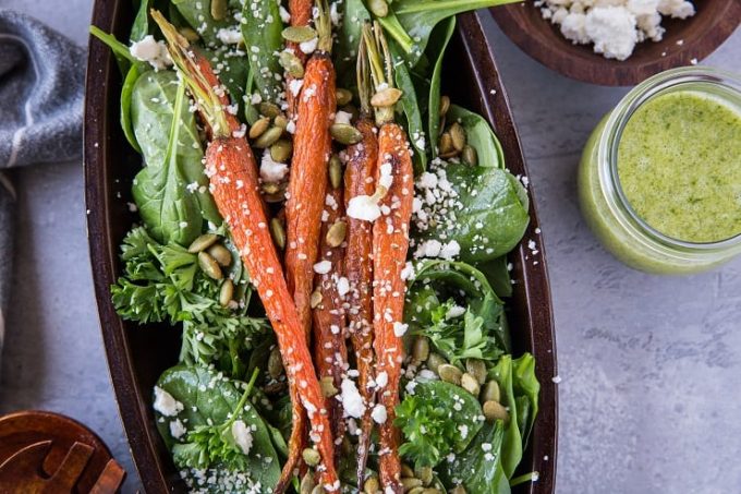Overhead view of a roasted carrot spinach salad.