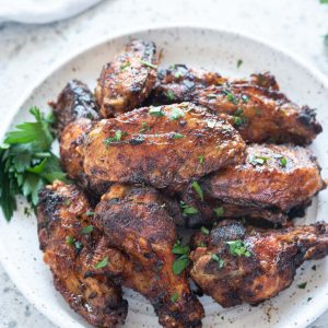 Air fryer chicken wings piled on a plate