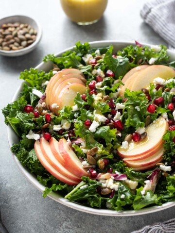 Kale apple salad with pomegranate and pepitas